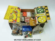 A turned wood draughts set, mahogany cased compass, playing cards,