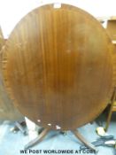 A reproduction tilt top table, max diameter 121cm,