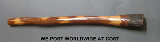 An Australian Didgeridoo 'naturally produced by termites', approximately 129cm length,
