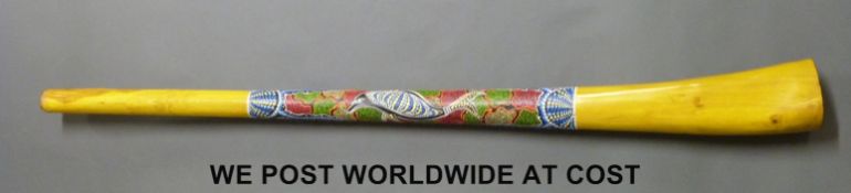 An Australian Didgeridoo with Aboriginal style bead paint decoration in the form of a dolphin,