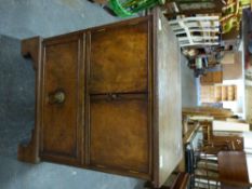 A Georgian mahogany bedside cabinet with cabinet and drawer below,