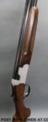 Beretta S56E 12 bore over and under shotgun with all over engraved decoration, vented top rib,