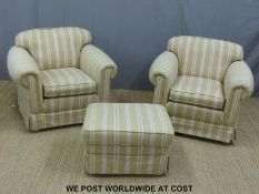 A pair of upholstered arm chairs with striped Laura Ashley style fabric