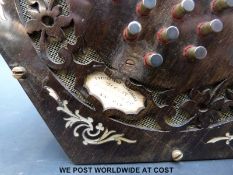A mid nineteenth century English concertina with rosewood fretworked ends decorated with mother of