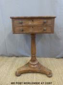 A 19th century mahogany work table with two drawers supported on a reeded column (W45 x D35 x