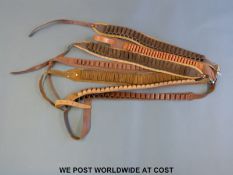 Seven leather cartridge belts including .410, 16 and 12 gauge.