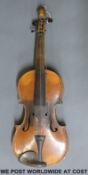 A mid 19th century lion head violin labelled Joseph Guamerius maker anno.
