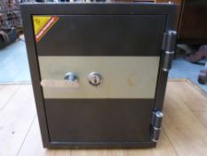 A floor standing safe with key and provision for adjustable shelving within (H55 x W45 x D45cm)