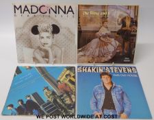 Several hundred 7” singles and EPs in six carry cases and two large boxes.