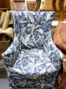 A wing back upholstered chair