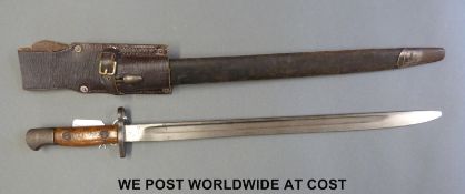 A British 1907 bayonet marked with GR under crown, EFD and dated 1907, in sheath with frog,