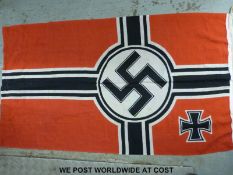 A WWII Kriegsmarine Nazi German flag with eagle and swastika with M below to edge and with