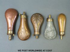 Five copper and brass and steel and brass pistol powder flasks some with embossed decoration by