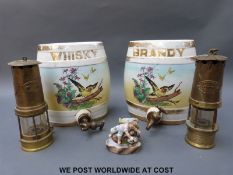 A pair of large ceramic barrels together with two miner's lamps marked W. E.