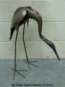 A garden sculpture of a heron in the manner of Walenty Pytel but not marked,