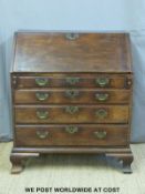 A Georgian mahogany bureau with fitted interior, secret drawer,