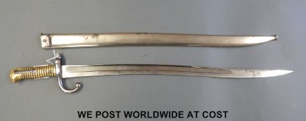 A French 1866 chassepot bayonet with brass grips and metal scabbard
