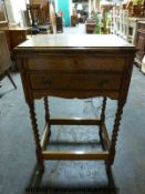 An oak cutlery canteen raised on barley twist legs (W50 x D39 x H80cm)