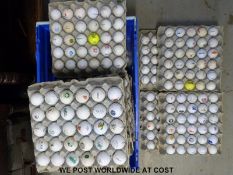 Approximately 400 golf balls with logos in egg cartons,