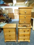 A pair of pine bedside chests of three drawers (W46 x D39 x H64cm) and a further similar example