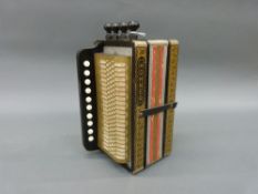 Hohner 4 stop German melodeon in pokerwork finish, with ten treble buttons and two spoon bass,
