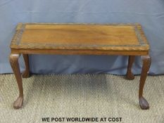 A carved teak coffee table,