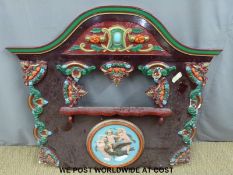 A painted and moulded fairground sideshow surround (W151 x H142cm)