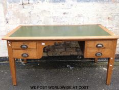 An oak twin pedestal desk (W152 x D84 x H75cm)