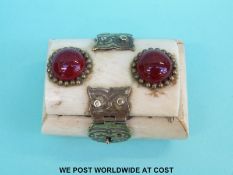A small bone box set with red cabochons and brass clasps (length 6cm)