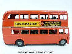 Tri-ang Minic tin plate clockwork Routemaster Bus with red body and 'Try Out Your London Bus' and