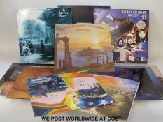 Twelve Moody Blues-related LPs with inserts,