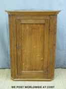 A Georgian oak corner cupboard,