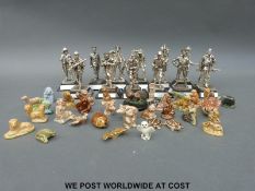 A collection of Royal Hampshire metal figures together with a collection of Wade Whimsies