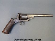 An 11mm six shot percussion revolver with ornate engraving to the locks and butt plate,