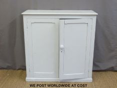 A two door painted pine cupboard (W106 x D40 x H107cm)
