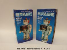 Two battery operated Space Walk Man robots,