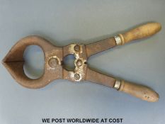 A vintage bull castrating tool