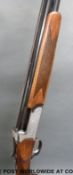 Midland Gun Company 12 bore over and under shotgun with ornate engraving,