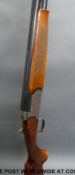 Browning Medallist 12 bore over and under shotgun with named and ornately engraved locks,