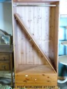 A pine two door wardrobe with drawer under