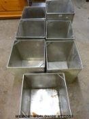 A quantity of stainless steel ice cream containers,