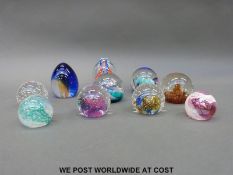 A collection of ten boxed Caithness paperweights including four collectors' club examples and a