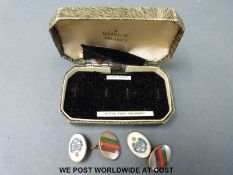 A cased pair of Royal Tank Regiment enamel cuff links