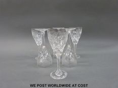 A set of six cut and engraved wine glasses