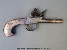 Flintlock hammer action double barrelled pistol with engraved decoration and 2.