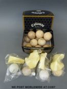 A collection of vintage golf balls including Penfold, Gutta Percha, Fred Freemantles, Spalding,