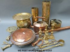 A collection of copper and brassware including shell cases, copper kettle, bedpan,
