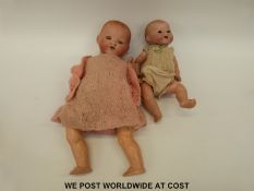 Two Armand Marseille bisque headed dolls one with open mouth and jointed composite body marked to