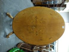 A 19th/20th century inlaid tilt top low table, max diameter 102cm,