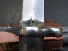 A Swedish bayonet with metal cross-cut grip handle,